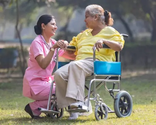 Doctor warmly holding the hands of a senior patient