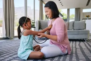 Caregiver guiding a senior through gentle exercises at home