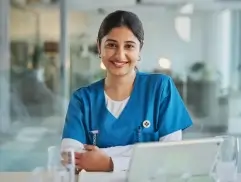 Smiling nurse holding a medical tablet